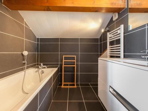 a bathroom with a bath tub and a sink at Chalet Avoriaz, 8 pièces, 14 personnes - FR-1-314-101 in Avoriaz