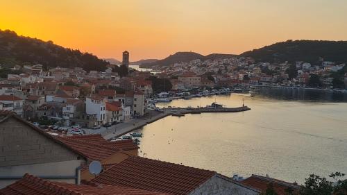 a view of a city with a river and buildings at Apartments Valentina Tisno in Tisno