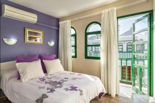 Postel nebo postele na pokoji v ubytování Bungalow DUNA FLOR VERDE Maspalomas