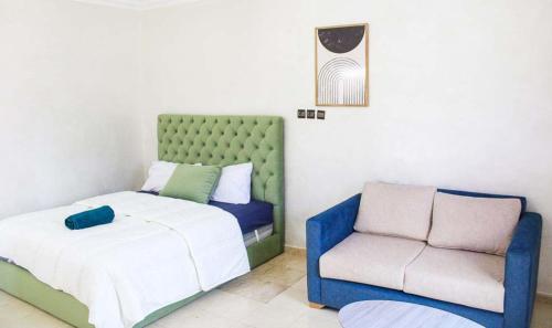 Postel nebo postele na pokoji v ubytování Akwaba lodge