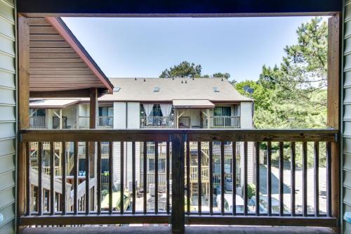 a view from the balcony of a house with a gate at half Mi to Maryland Beach Family Condo with Balcony in Ocean City
