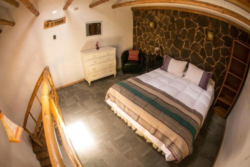 Ένα ή περισσότερα κρεβάτια σε δωμάτιο στο Hotel Parina Atacama