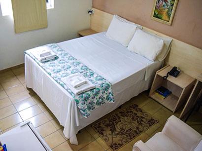 Un ou plusieurs lits dans un hébergement de l'établissement Hotel Nações