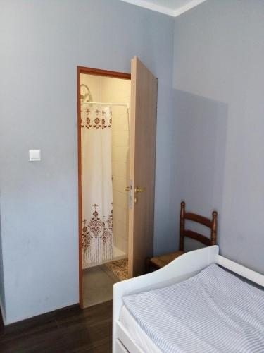 Ένα ή περισσότερα κρεβάτια σε δωμάτιο στο Motelik Lukitas