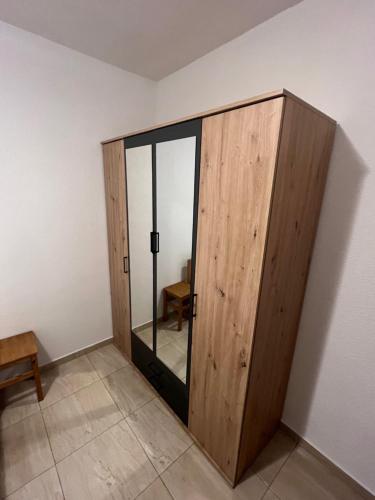 a wooden door in the corner of a room at Apartments Purkovic in Vodice