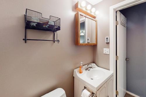a bathroom with a sink and a toilet and a mirror at Glorious Scenery in Dover