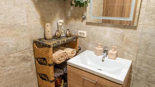 a bathroom with a sink and a mirror at Authentic Vacation Flat Near Beach in Kotor in Kotor