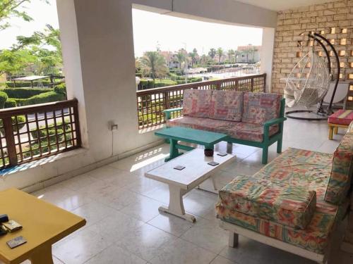 a living room with a couch and a coffee table at Beit Rumi in El Alamein