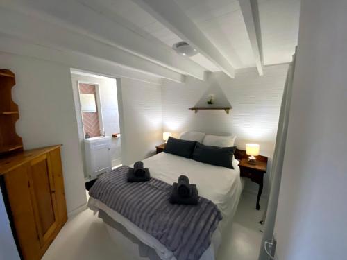 a bedroom with a bed and a table and a window at Prometheus in Lake Marina