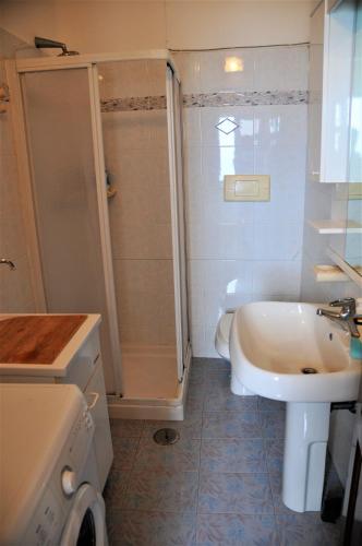 a bathroom with a shower and a sink and a toilet at Villa Gesualda in Serrara Fontana