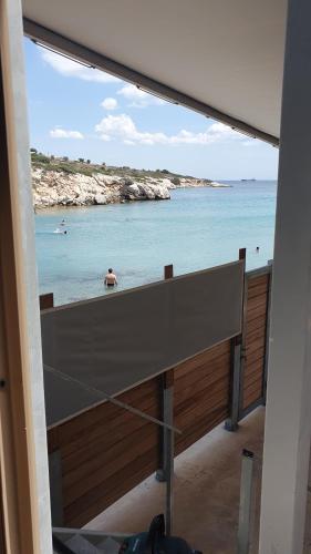 a view of the ocean from a room with a desk at AQUA VILLA in Selínia