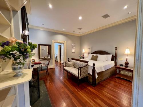 a bedroom with a bed and a couch and a chair at Stonegate in Lexington