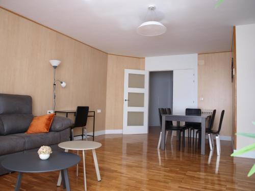 a living room with a couch and a table at Apartamento Sadar in Pamplona