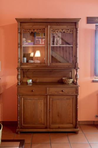 an old wooden hutch in a room at El Molino de Bonaco in San Vicente de la Barquera