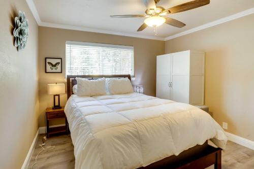 a bedroom with a large bed with a ceiling fan at Homey South Lake Tahoe Getaway - 1 Mi to Beach in South Lake Tahoe