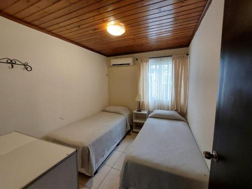 Un ou plusieurs lits dans un hébergement de l'établissement Hotel Jardines de Dayman