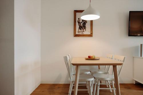 a dining room with a table and chairs at Appartement Schwarz in Sankt Johann im Pongau