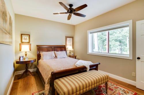 a bedroom with a bed and a ceiling fan at Charming Starkville Vacation Rental about 5 Mi to MSU! in Starkville