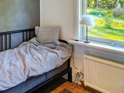 מיטה או מיטות בחדר ב-Holiday home MULLHYTTAN II