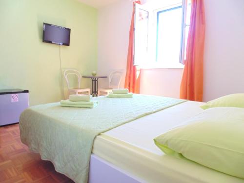 Postel nebo postele na pokoji v ubytování Guest House Petricevic