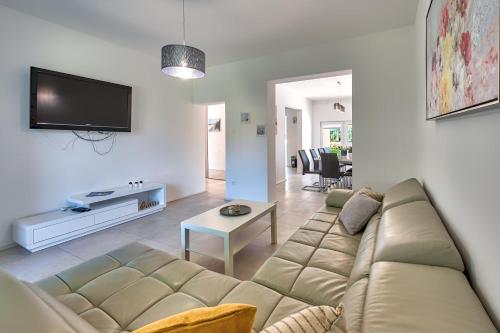a living room with a couch and a table at VILLA Matija in Ližnjan