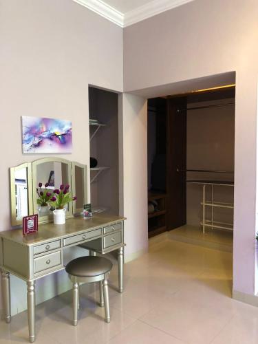 TV a/nebo společenská místnost v ubytování Villa Segovia Cozumel