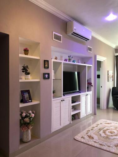 TV a/nebo společenská místnost v ubytování Villa Segovia Cozumel