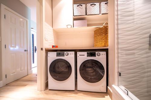 a laundry room with two washer and dryer at Kapalua Villas Maui in Lahaina