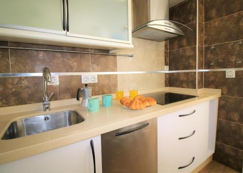 Kuchyňa alebo kuchynka v ubytovaní Descubre Málaga desde un Apartamento en su Centro Histórico