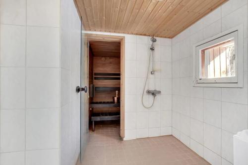 a bathroom with a shower and a walk in shower at Cozy cottage in Pontus in Lappeenranta