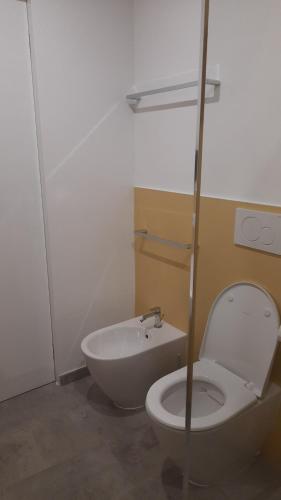 a bathroom with a toilet and a sink at Locanda Göghin in Pieve Ligure