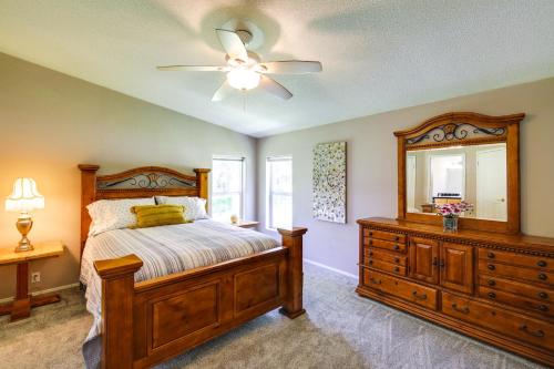 a bedroom with a bed and a dresser and a mirror at Peaceful Hideaway about 16 Mi to Downtown Missoula! in Wye