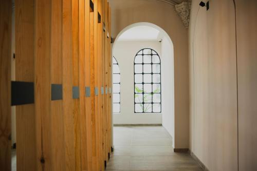 an empty hallway with a window in a building at Casa Lomah Napoles WTC in Mexico City