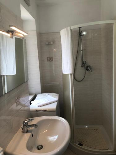 a bathroom with a shower and a sink at Casa Angela in Vasto