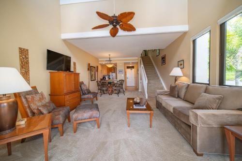 a living room with a couch and a table at Kapalua Villas Maui in Lahaina
