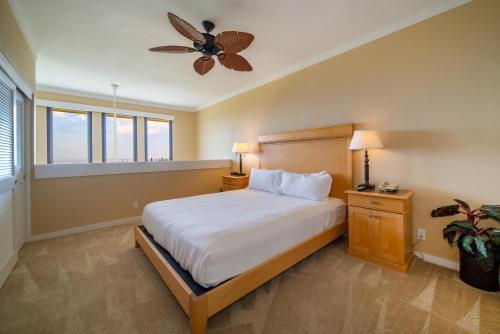 a bedroom with a bed and a ceiling fan at Kapalua Villas Maui in Lahaina