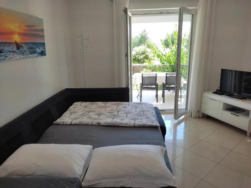 Postel nebo postele na pokoji v ubytování Grey House Zadar