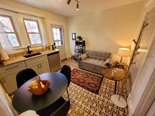 a living room with a table and a couch at The Nook at UVA in Charlottesville