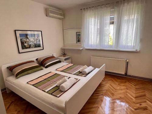 Postel nebo postele na pokoji v ubytování Guest House Kiwi Mostar