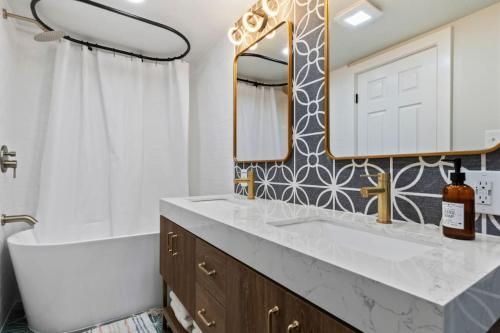 a bathroom with a sink and a mirror at Amazing New Condo Great Location ! Sugarhouse in South Salt Lake