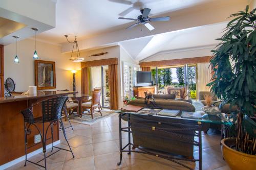 a living room with a couch and a table at Kapalua Villas Maui in Lahaina