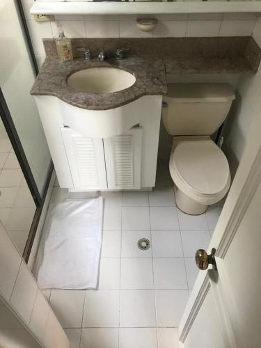 a bathroom with a sink and a toilet in it at apartasuitte poblado 607 in Medellín