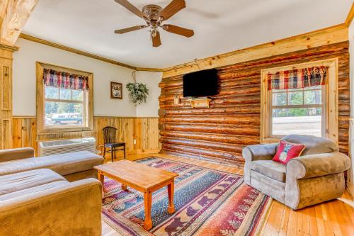 a living room with a log wall at The Logs in Snowden