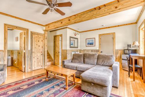 a living room with a couch and a table at The Logs in Snowden