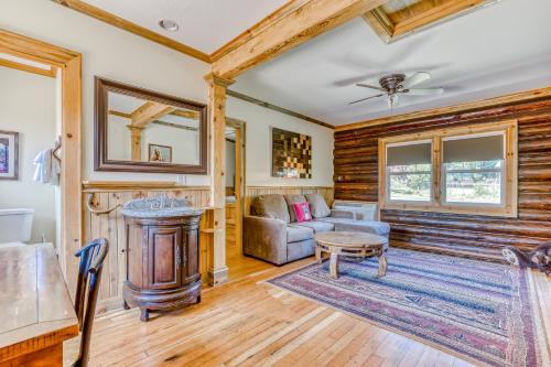 a living room with a couch and a table at The Logs in Snowden