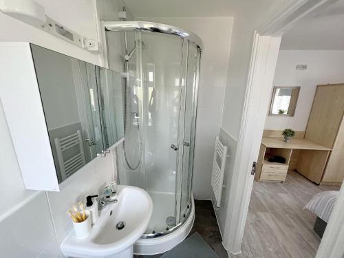 a bathroom with a shower and a sink at Flat 12 Palm Court in Bournemouth