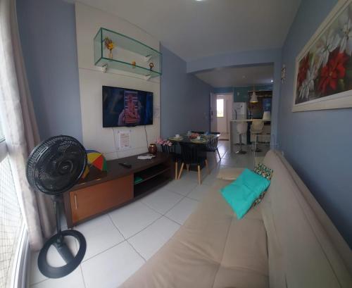 an overhead view of a living room with a table at Muro alto condomínio clube in Ipojuca