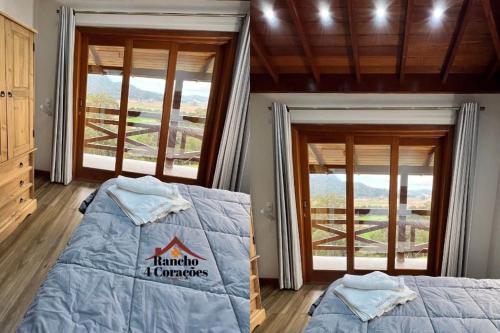 a bedroom with two beds and windows with a view at Rancho 4 Corações in Urubici