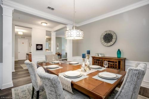 a dining room with a wooden table and chairs at Lake View 3 Bedroom In Vista Cay Resort condo in Orlando