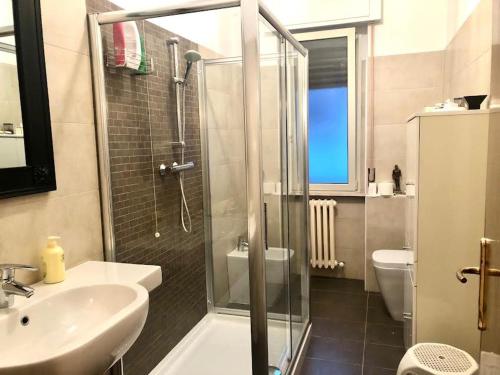 a bathroom with a shower and a sink and a toilet at Regina in Ortona